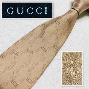 ■美品■GUCCI グッチ　ネクタイ　金具　Gマーク　総柄　シルク100% イタリア製　ベージュ　ビジネス