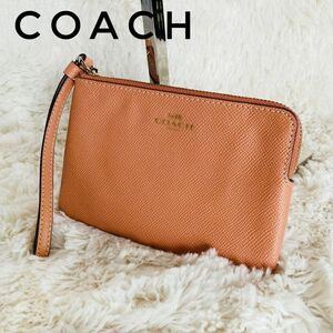 COACH コーチ ハンドストラップ付きレザーポーチ リストレット オレンジ系