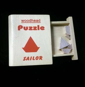 WOOD HEAD PUZZLE Sailor ケースが丸背の本型